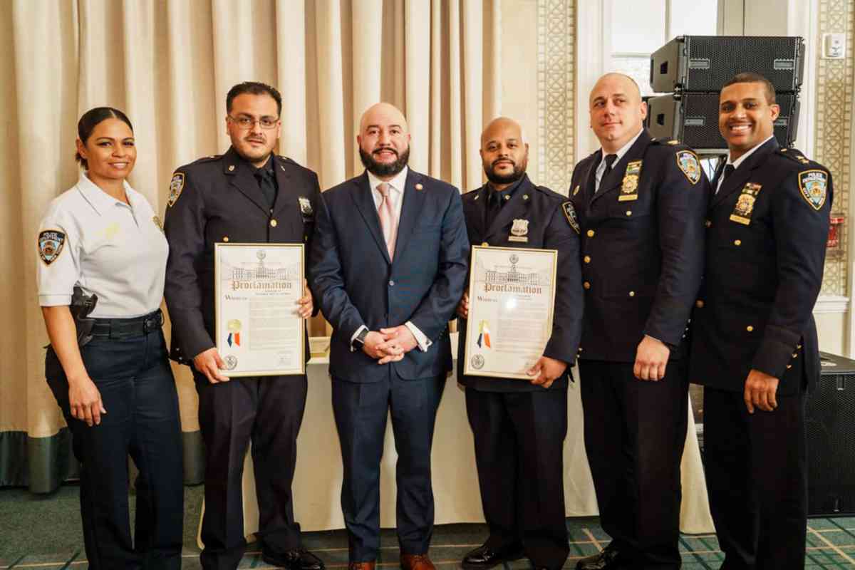 Councilmember Rafael Salamanca, Jr. stands with a few of the honorees at the Heroes Recognition Breakfast.