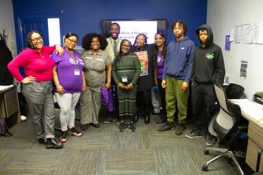 Legal Hand employees and volunteers smile for a photo.
