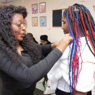 Pamela Damon, executive director at Not On My Watch, Inc. assisting one of the young ladies in preparing for their personal photoshoot.