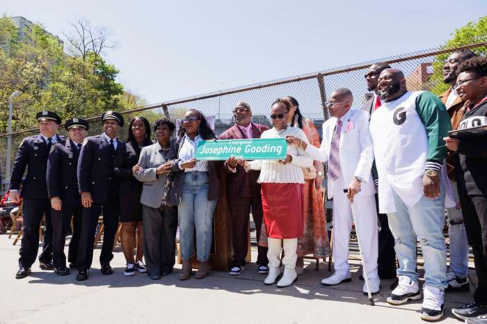 Community members, NYPD, elected officials and family of Josphine Gooding pose for a photo with a street sign co-named in her honor at Macombs Road at W Mt. Eden Avenue in the Bronx on Tuesday, April 23, 2024.