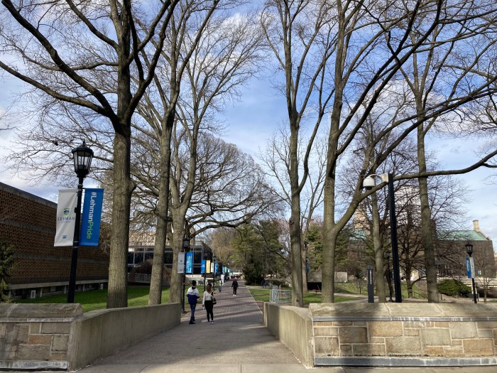 Students walk on the Lehman College campus on March 15, 2024.