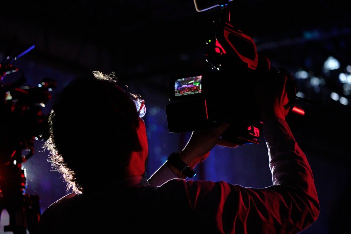 A camera man pans across the floor of the Bronx Ball before notable community members are honored. Photographers and videographers flow between tables to capture every moment on May 18, 2024.