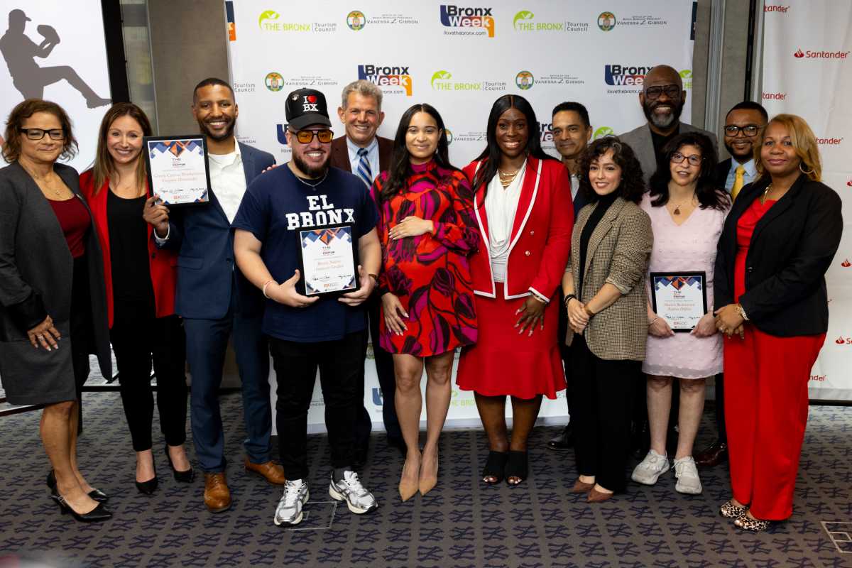 Finalists stand with judges, sponsors, and hosts of the competition.