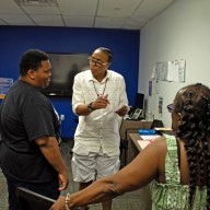 Rachelle Brown converses with attendees about strategic ways to upgrade their resumes.
