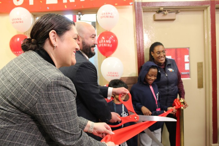 New York City Council Member Rafael Salamanca Jr. cuts the ribbon on the new laundry room at the Longwood Academy of Discovery on Friday, May 3, 2024.