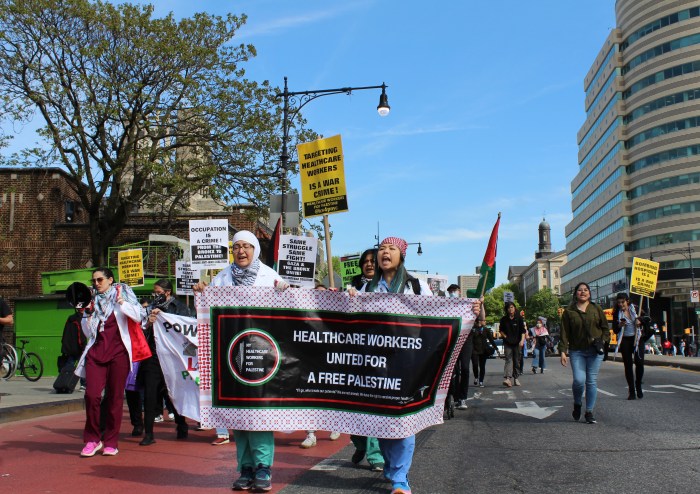 Demonstrators briefly block traffic on East Fordham Road during a rally for Gaza on Friday, May 3, 2024.