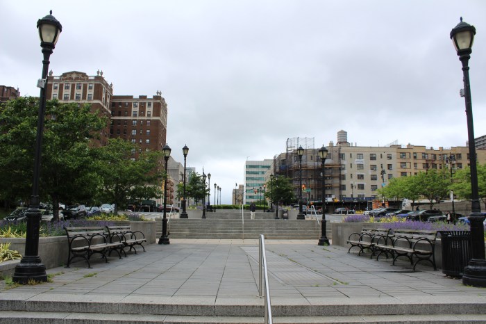 Trey Jenkins, the 161st Street Business Improvement director, walks in Lou Gehrig Plaza on Friday, May 10, 2024.