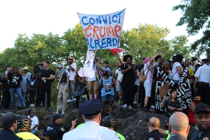 Counter protestors demonstrate outside former President Donald Trump's campaign rally in the Bronx's Crotona Park on May 23, 2024.