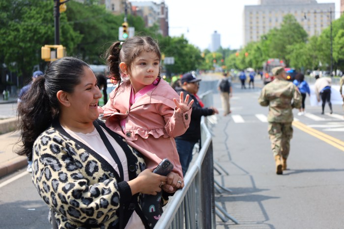 Three-year-old Isabela waved to parade participants as they passed by in 2023's Bronx Week Parade.