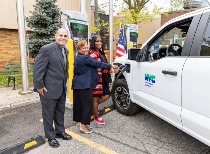 City officials test the new Hunts Point EV chargers.