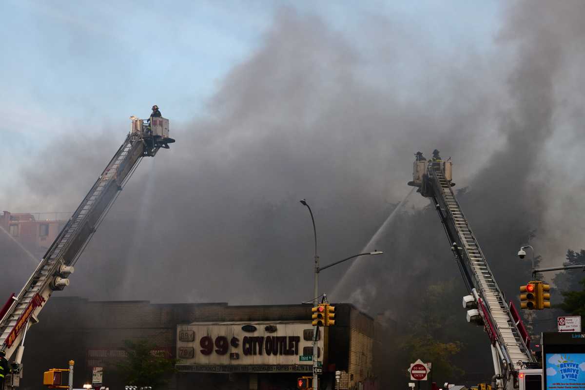Firefighters battled a four-alarm fire in a row of commercial buildings on Third Avenue in Melrose on Thursday, June 20.