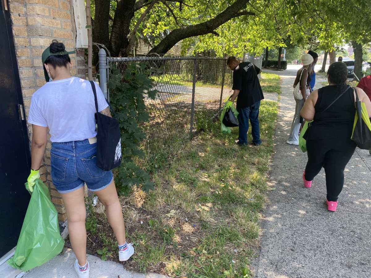 A group of volunteers cleans up Louis Niñé Boulevard during the kick-off of the Bronx Summer Cleanup Series.