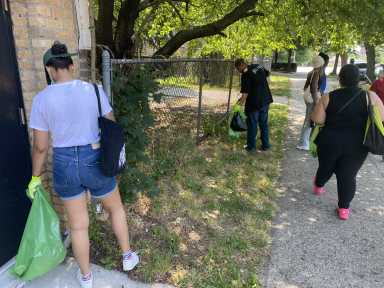 A group of volunteers cleans up Louis Niñé Boulevard during the kick-off of the Bronx Summer Cleanup Series.