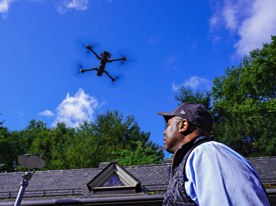 NYPD Deputy Commissioner Kaz Daughtry flies a police drone outside of the Central Park Precinct.