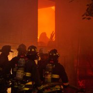 Firefighters at the scene of a three-alarm fire in Port Morris on July 1, 2024.