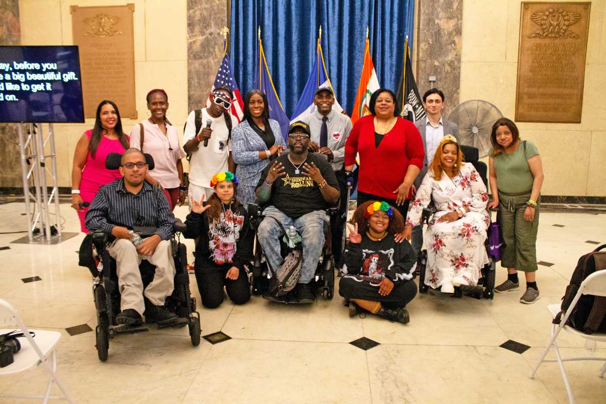 A group photo with Bronx Borough President Vanessa L. Gibson; hip hop artist Namel "Tap Waterz" Norris; Commissioner James Hendon from the New York City Department of Veterans Services; staff members; Khalia Hayslett(Travel Educator for Disabled New Yorkers & beyond and Miss Wheelchair New York 2023) and others.