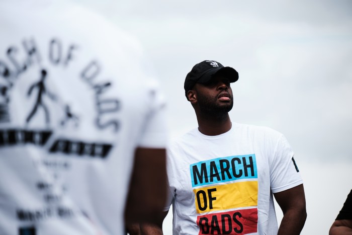 Dads attend the March of Dads held by Dad Gang in Mill Pond Park on June 29, 2024.