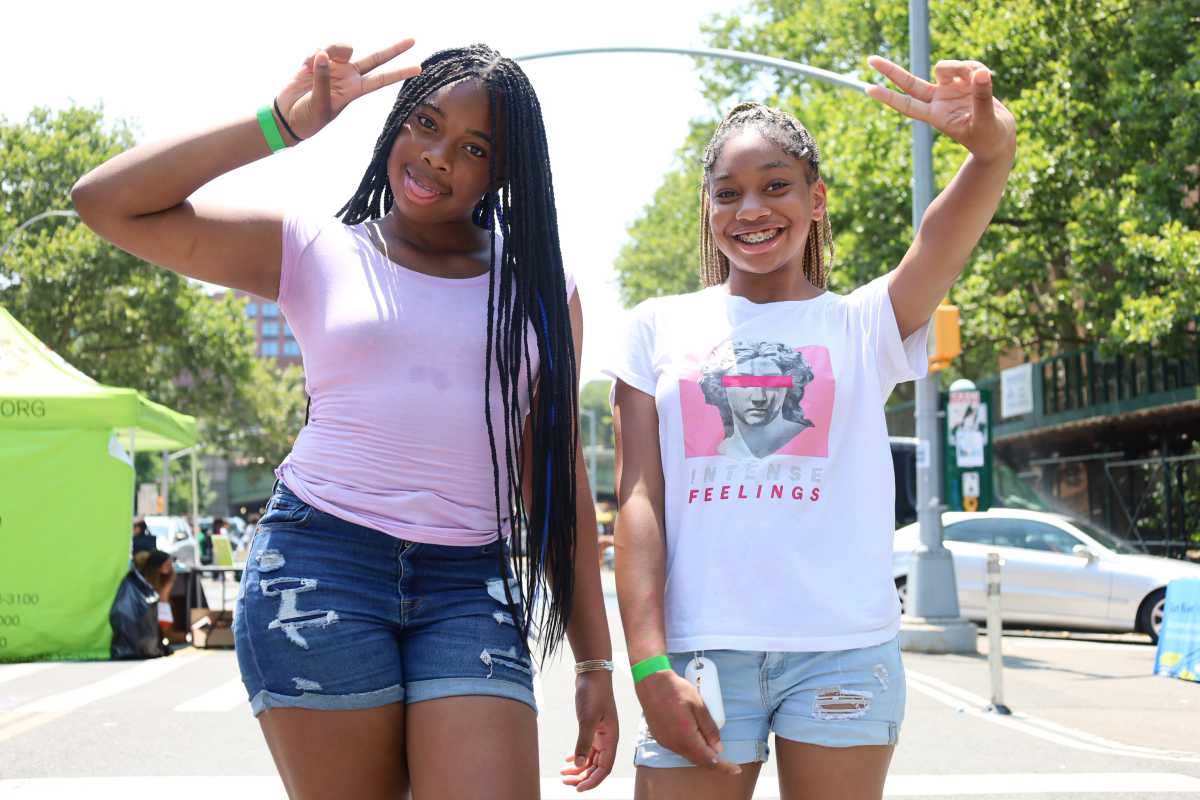 Takhya (l.), 12, and Sariyah, 11 were having fun on Wednesday, July 17 at the New York Psychotherapy & Counseling Center's fifth anti-bullying fair in the South Bronx.