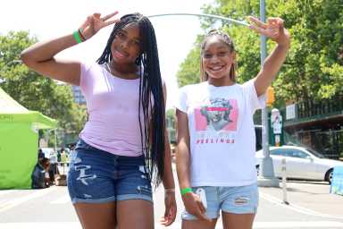 Takhya (l.), 12, and Sariyah, 11 were having fun on Wednesday, July 17 at the New York Psychotherapy & Counseling Center's fifth anti-bullying fair in the South Bronx.