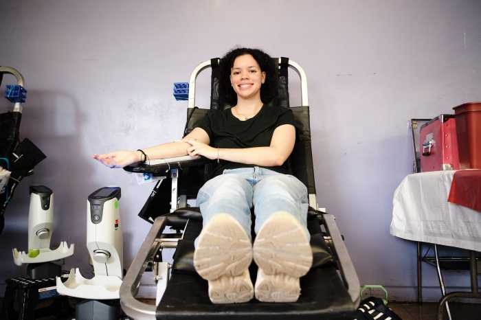 Nataly waits for a bandage after getting her blood drawn at the Van Cortlandt Jewish Center in the Bronx, N.Y. on Sunday, July 28, 2024