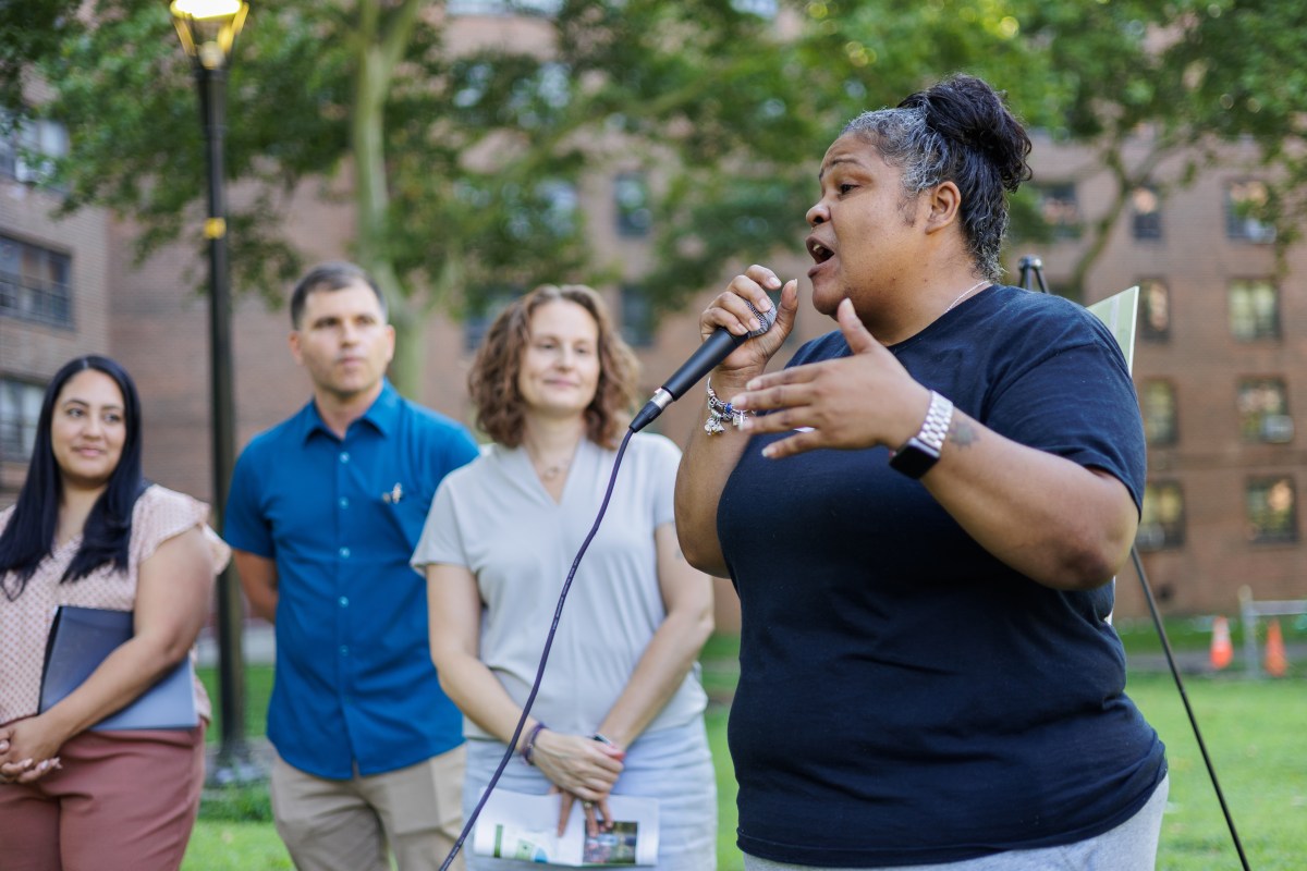 Jeannette Salcedo, Castle Hill Resident Association president speaks during a groundbreaking ceremony for an improved green space project, including a dog park, at the at the Castle Hill Houses in Castle Hill on Monday, Aug. 5, 2024.