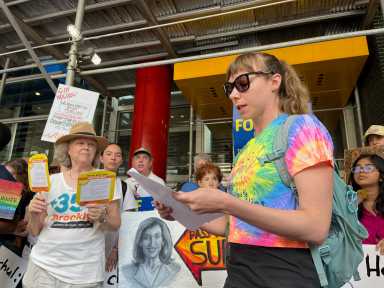 Pelham Parkway resident Sarah Fecht (right) rallied with other advocates for Gov. Hochul to sign the Climate Change Superfund Act, which would require oil companies to pay towards climate change mitigation efforts.