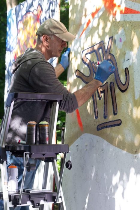<span class="image-credit">SJK 171 live paints at the exhibit. Photo courtesy Edward Jamison