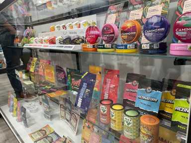 Bronx dispensaries like Hush New York display brightly colored containers of legal cannabis products.