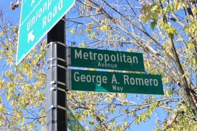 A street sign reading, "George A. Romero Way".