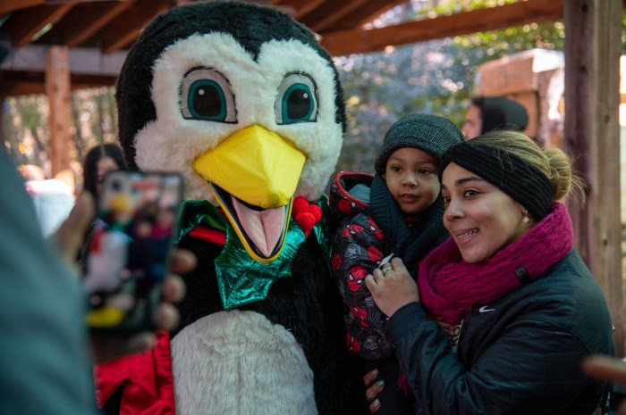 Veterans and family took photos with a giant penguin who danced and entertained children. 