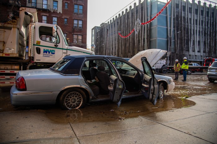 Mr. Brown's car, a 1999 Mercury Grand Marquis was flooded Monday night after a water main ruptured on Webster Avenue in Bedford Park.