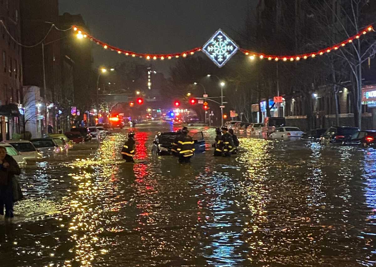 A busted water main flooded Webster Avenue near Mosholu Parkway in Bedford Park Monday night.