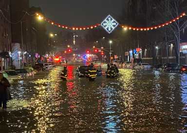 A busted water main flooded Webster Avenue near Mosholu Parkway in Bedford Park Monday night.