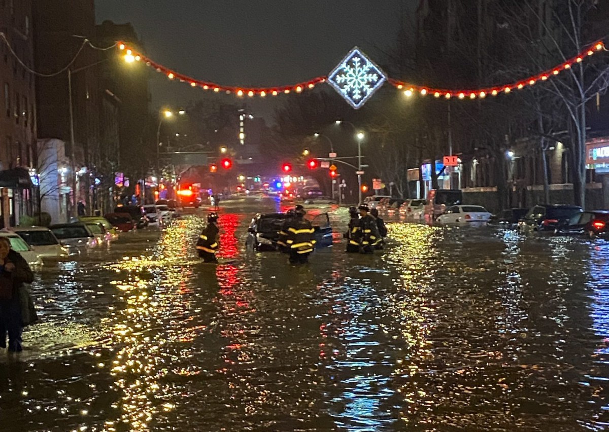 A busted water main flooded Webster Avenue near Mosholu Parkway in Bedford Park Monday night.