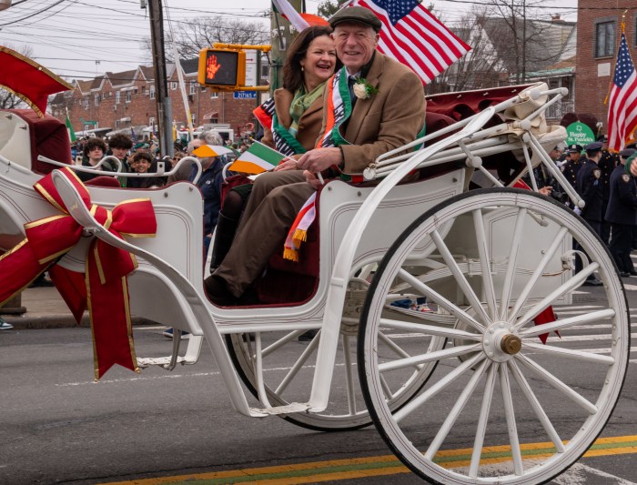 The 2025 Throggs Neck St. Patrick's Day parade Grand Marshals, Edel and Michael Morrissey led the parade in an all white horse drawn carriage.