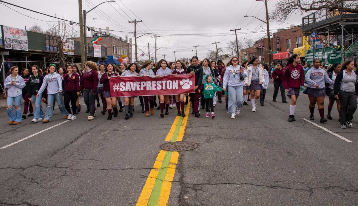 Preston High School students, parents and alumni used the Throggs Neck St. Patrick's Day Parade to make their voices heard, chanting "save our school" while marching along East Tremont.