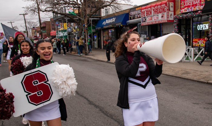 Preston High School's cheer squad still performed in the parade, but instead of festive cheers, they lead chants like, "don't take out school away!"