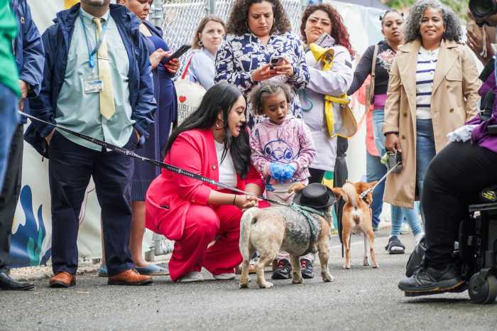 NYC Council Majority Leader Amanda Farias introduced a couple of furry friends to a young girl Friday at the unveiling of the new dog park at Castle Hills Houses.