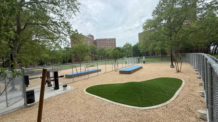 The first dog park in the city to be located within a NYCHAA community has separate spaces for large and small dogs, turf covered mounds, long elevated boxes and access to a doggie water fountain.