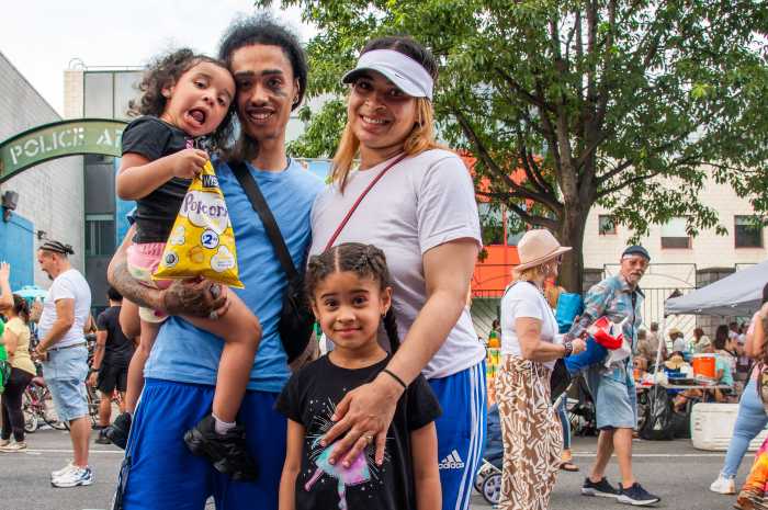 Andrew Bello and Adelle Rosa brought their young daughters Madison Ruiz (Left) and Avyanna Rose (Right) to dance and play. The family missed the Puerto Rican Day Parade because of rain and were happy they could celebrate at the Longwood Festival with their daughters. 