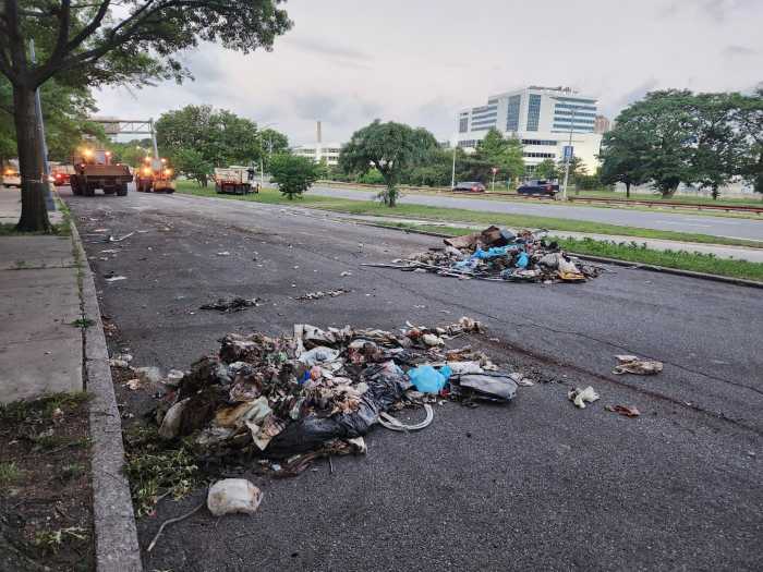 After the dismantled trailer had been cleared away, DSNY cleaned up what was left of its contents—smaller mounds of trash and debris left over on the Hutchinson River Parkway.