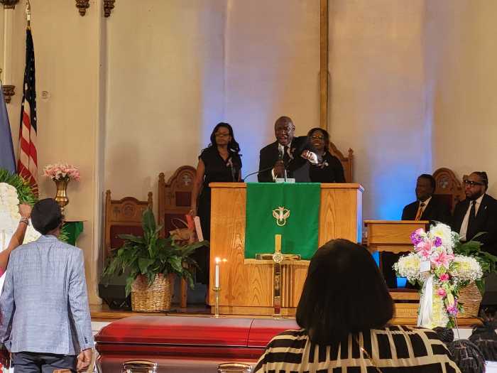 People at pulpit during funeral of girl who died in NYPD custody