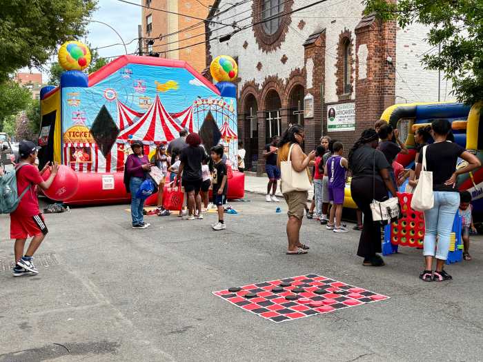 Families lined up outside an inflatable bounce house Thursday at the Bronx Defenders annual Block Party.