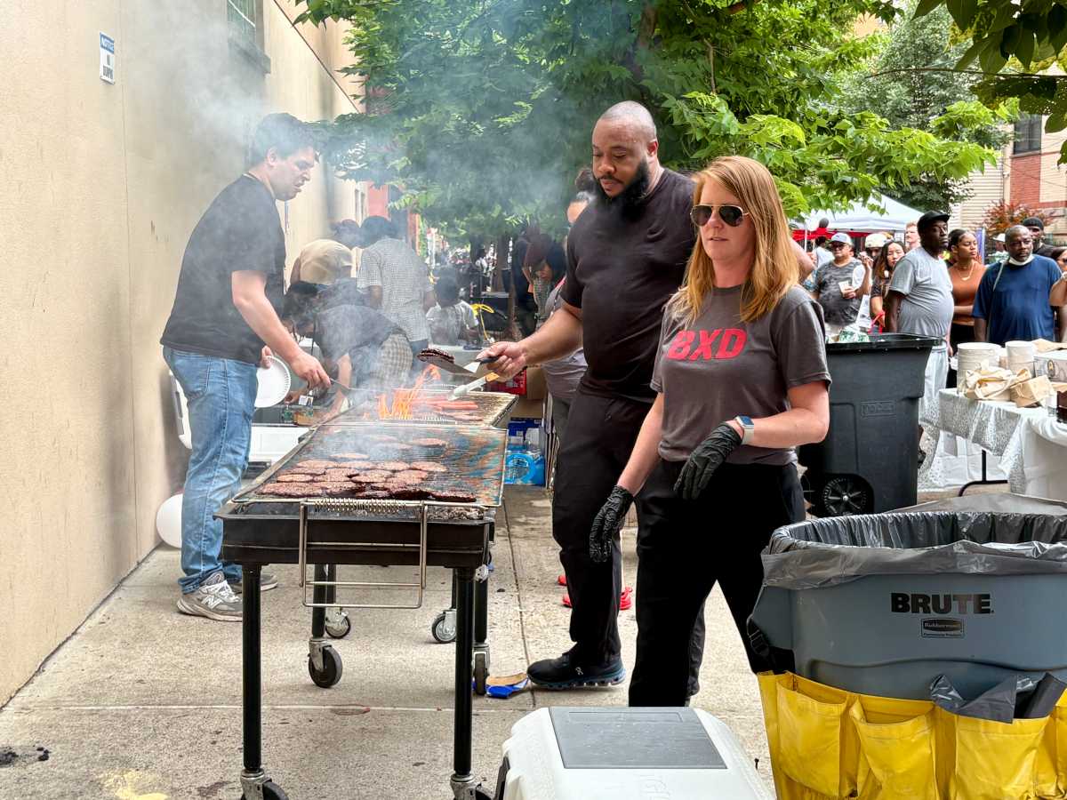 The Bronx Defenders grilled burgers and hotdogs for hundreds of hungry neighbors who had worked up an appetite enjoying music and games at the block party.