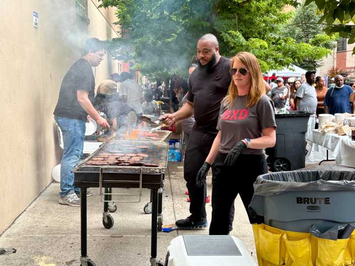 The Bronx Defenders grilled burgers and hotdogs for hundreds of hungry neighbors who had worked up an appetite enjoying music and games at the block party.