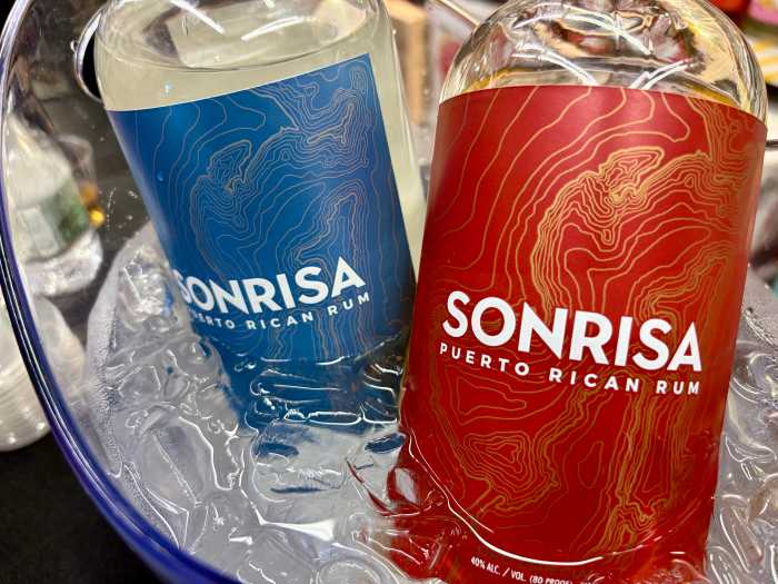 Bottles of Sonrisa Puerto Rican Rum sit chilled on ice, ready for Bronxites to sample the Platino and Oro Especial labels Tuesday.