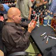 Bronx-born rapper and entrepreneur, Joseph Cartagena, also known as Fat Joe autographed bottles of Sonrisa rum at a Throggs Neck liquor store Tuesday. The hip hop legend partnered with the brand, which gives back to small business owners in Puerto Rico, where the rum is distilled.