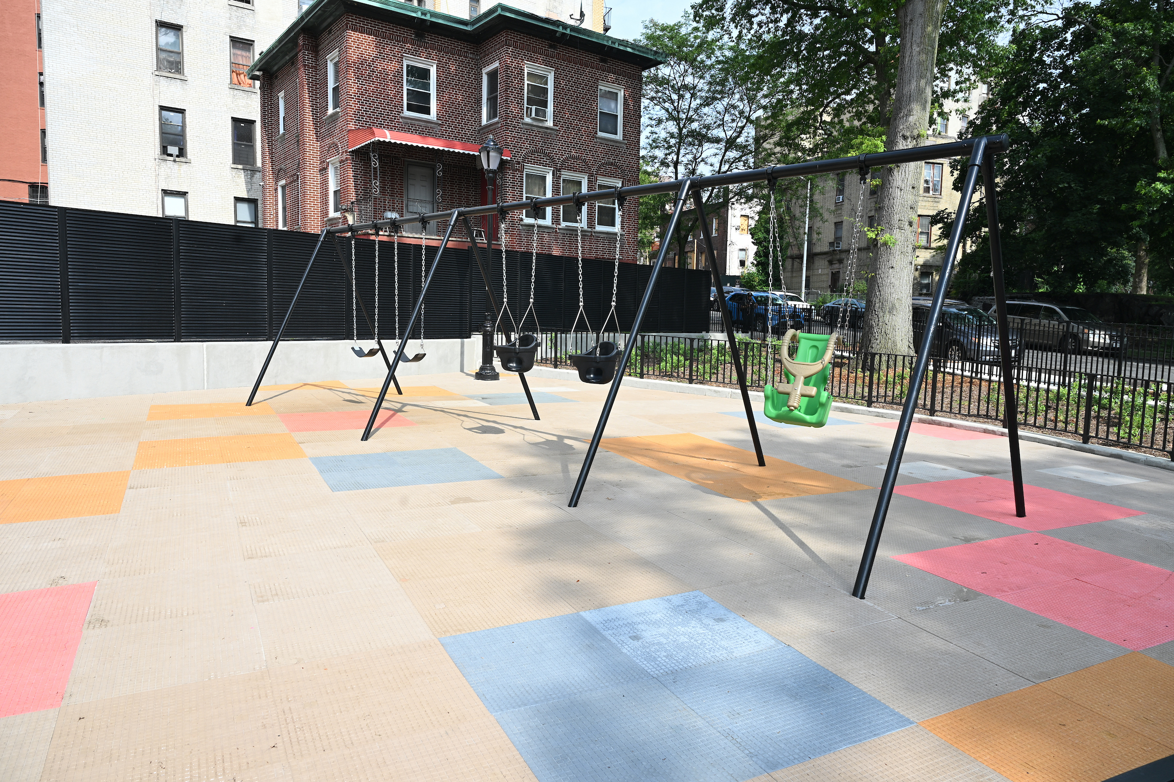 The newly renovated Strong Street Playground in Kingsbridge Heights features new swings.