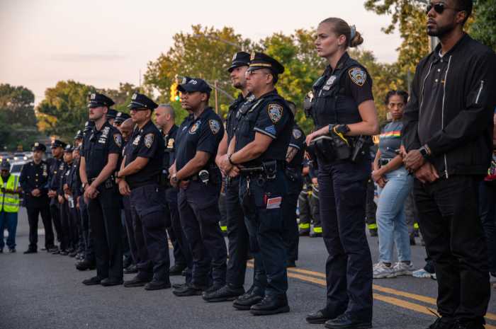 Officers stood outside the 47th Precinct for hours, listening to prayers and memories of the Bronx detective, who many described as a positive light who was quick to offer help and a smile.