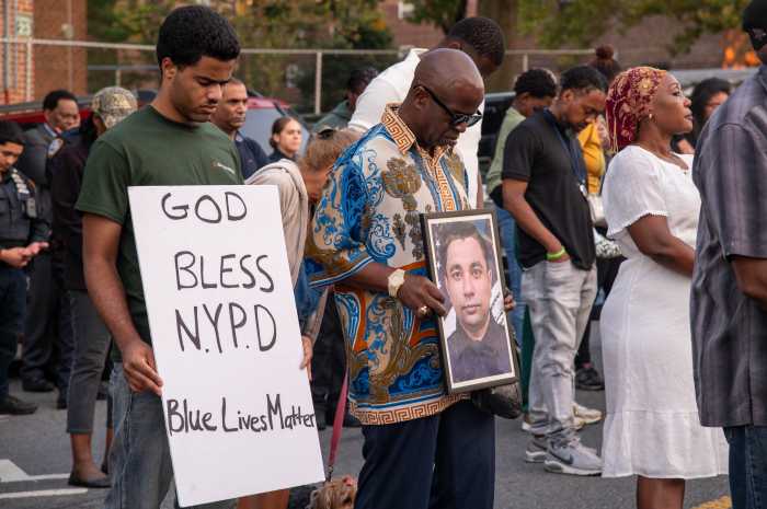 Community members, friends, family fellow officers and elected officials came together in faith, regardless of religion to pray for the 36-year-old slain cop, his family and the NYPD.